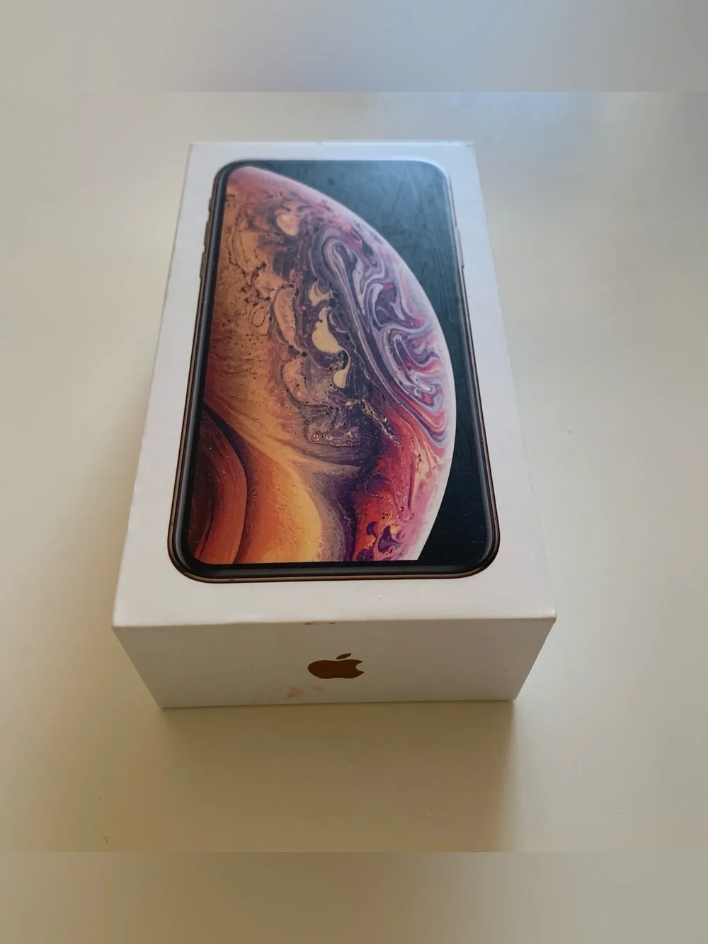 Empty iPhone Xs Gold Box and Apple Stickers